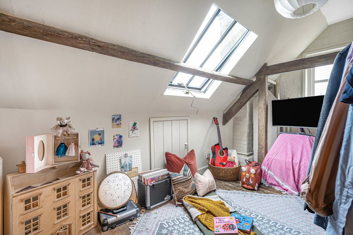 A smaller room under the roof, lit by a roof light
